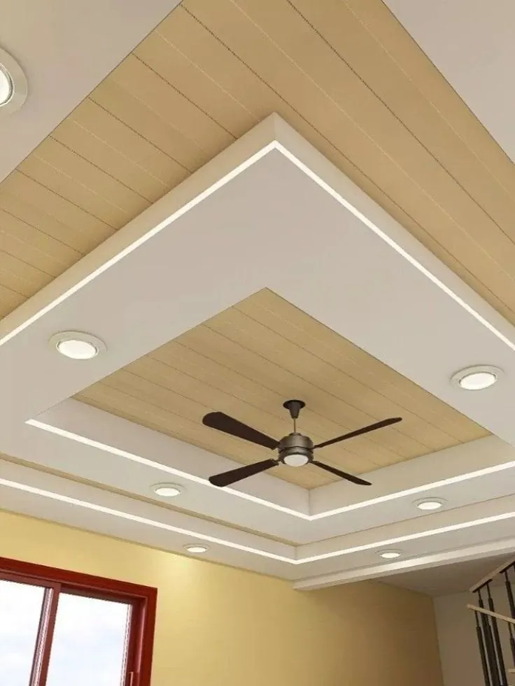 Gypsum ceiling with a wood-effect panel, ceiling fan and LED light lines