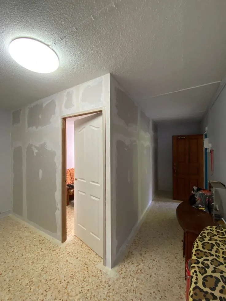 Gypsum board partition walls with a door opening, ready for finishing