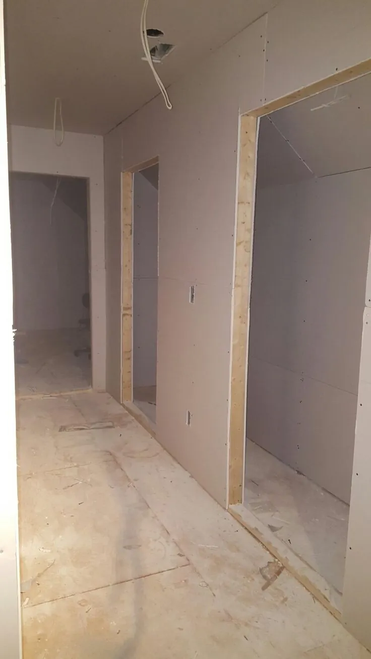 New gypsum board partition walls with door openings before painting