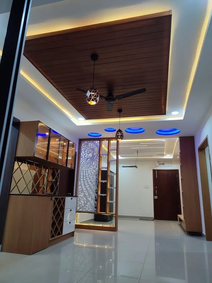 Wood-effect slatted ceiling panel with LED edge lighting in a room